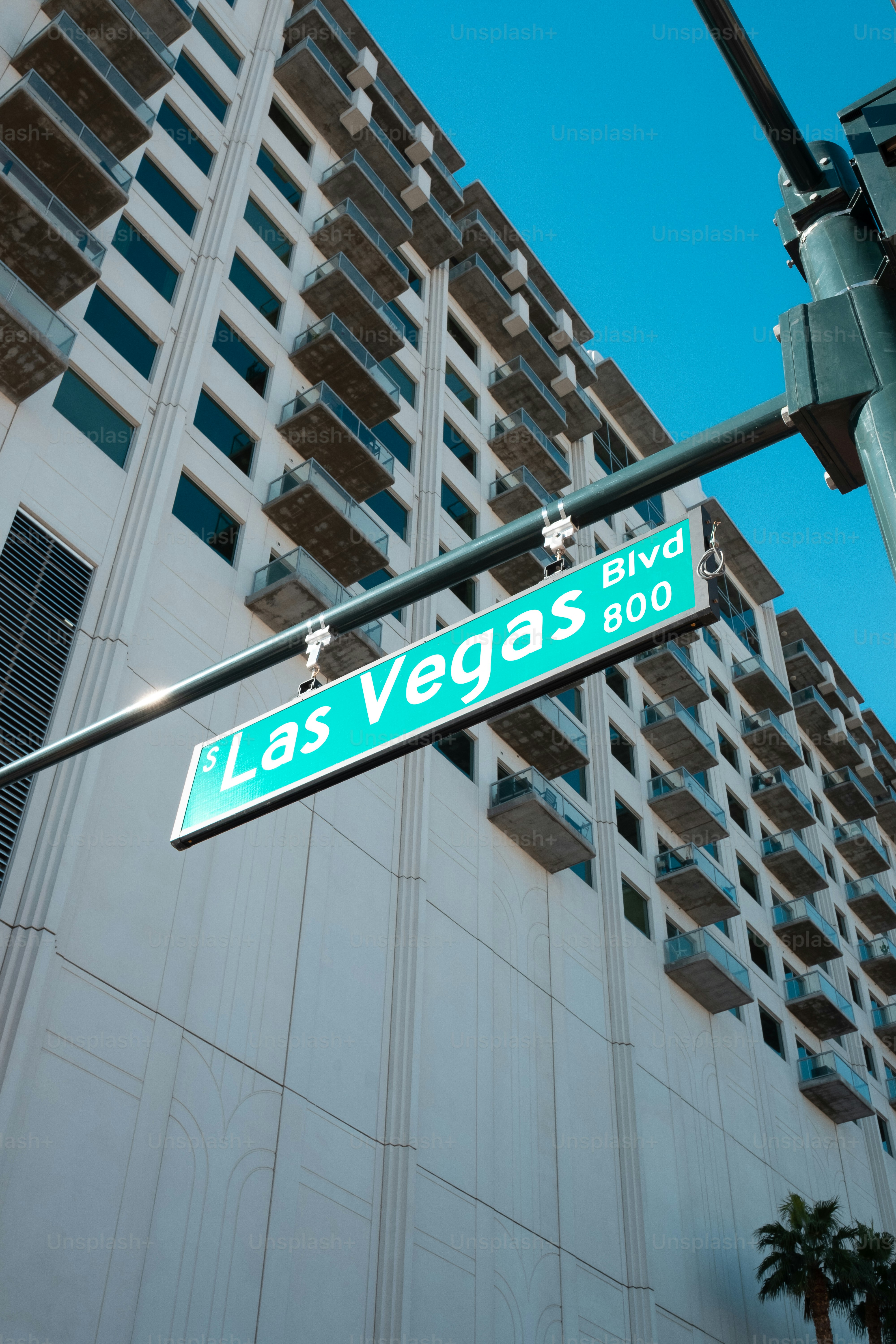 a street sign in front of a tall building